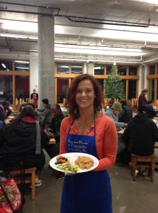 Bek serving dinner at the Blanchet House