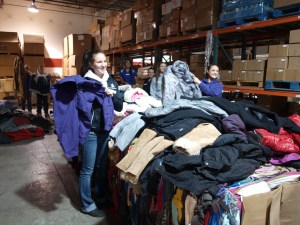 Teens sorting coats at Boise Rescue Mission