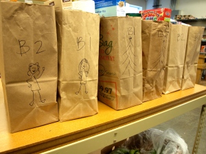 We drew pictures to keep the bags pairs together. Rebekah drew two volunteers on the left set of bags. 